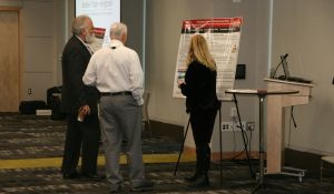 Maria Burns, visiting professor at the University of Houston, details her project during the Borders, Trade, and Immigration Institute's 2017 Showcase Tuesday, December 5, 2017, at American University. Her display was one of twelve projects showcased to an audience of Department of Homeland Security personnel, non-profit think tanks, and academic institutions.