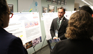 Nicholas Randol (center), graduate student at the University of the Incarnate Word, discusses the research process for his poster during the 2019 COE Summit Student Poster competition.